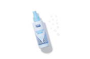 Skin & Tan Coconut Water Tanning Mist spraying a fine body mist