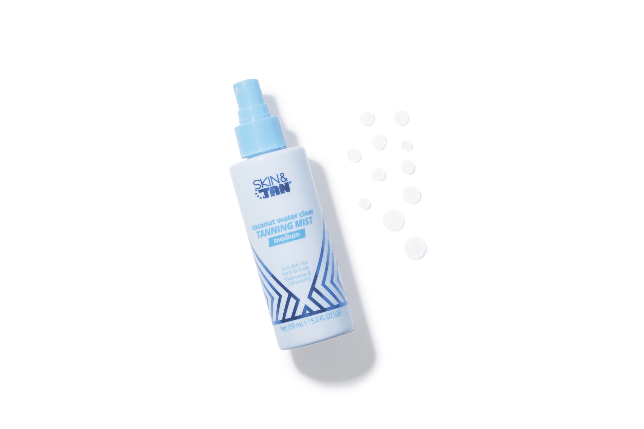 Skin & Tan Coconut Water Tanning Mist spraying a fine body mist