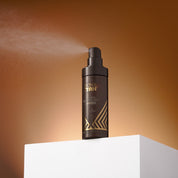 Skin & Tan Face Glow Hydrating Tanning Mist spraying a fine facial mist