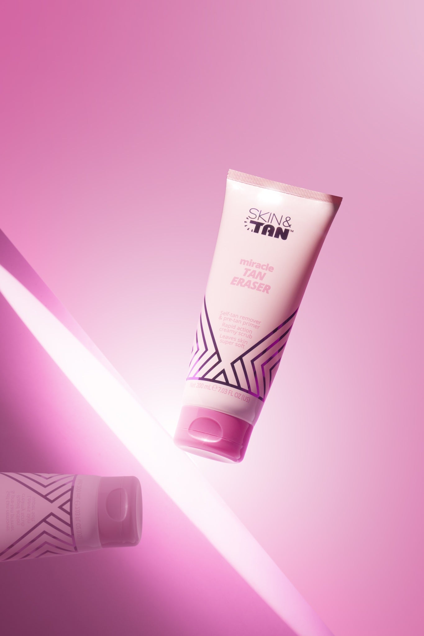 Miracle Tan Eraser self-tan remover in pink studio lighting